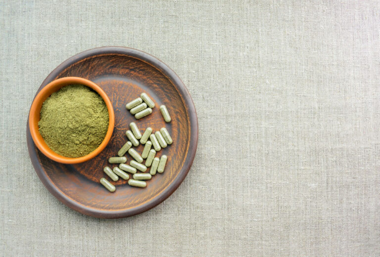 A bowl with powder and pills with similar contents but different effects and kratom onset time